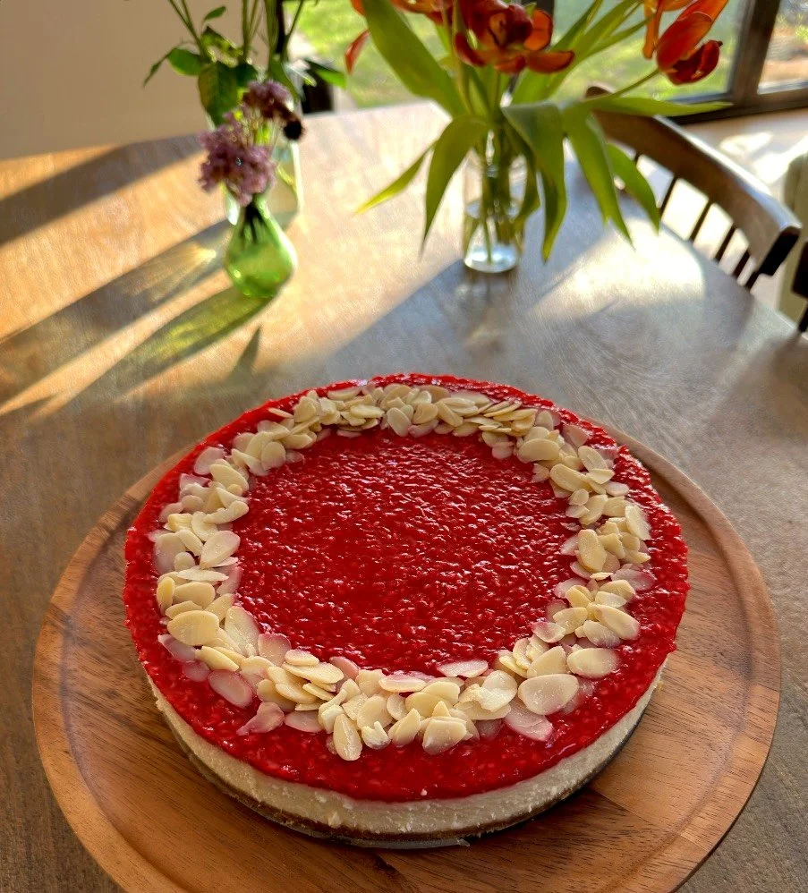 Almond and fresh raspberry topped cheesecake baked in Girton, Cambridge