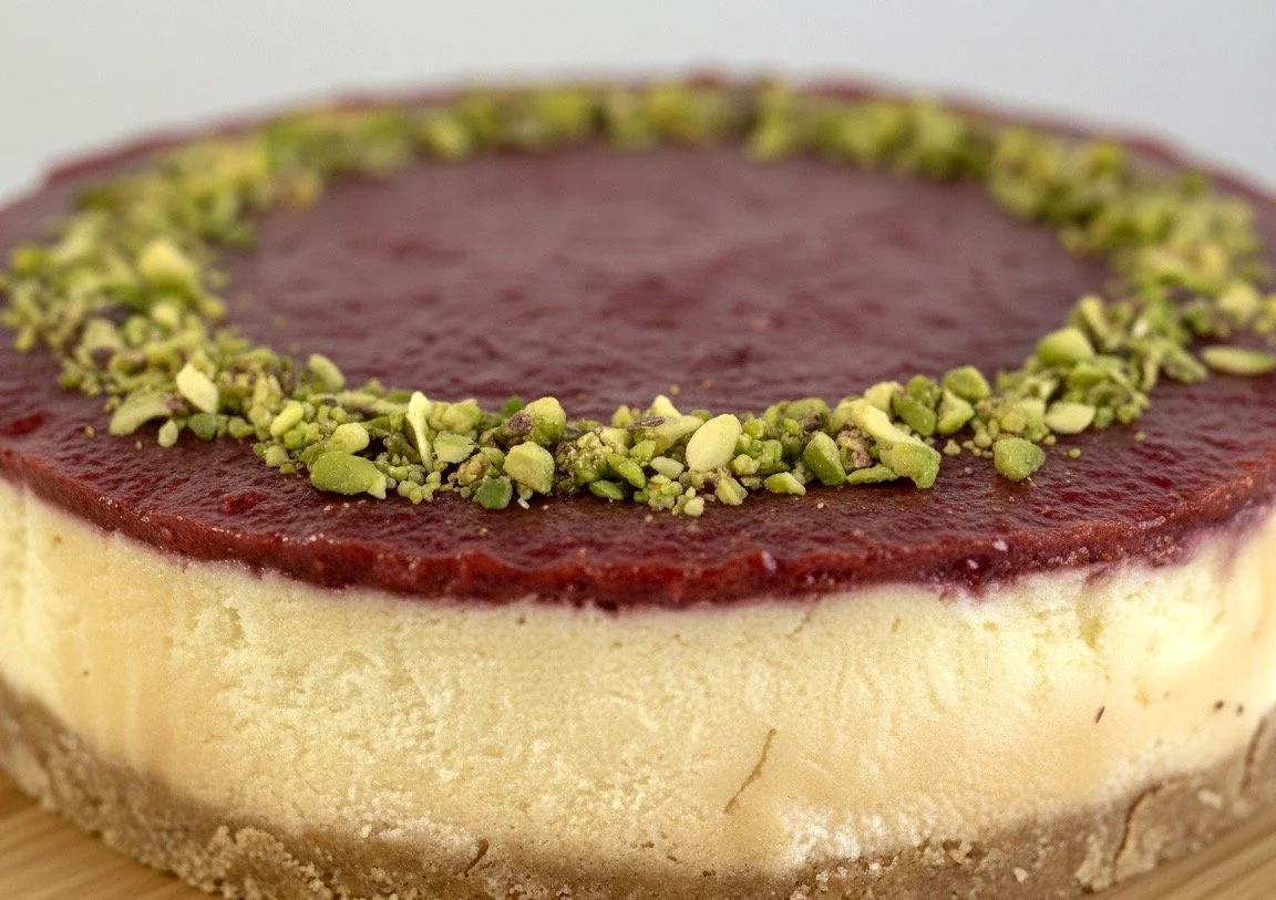 Layered raspberry pistachio crusted gourmet cheesecake Cambridge