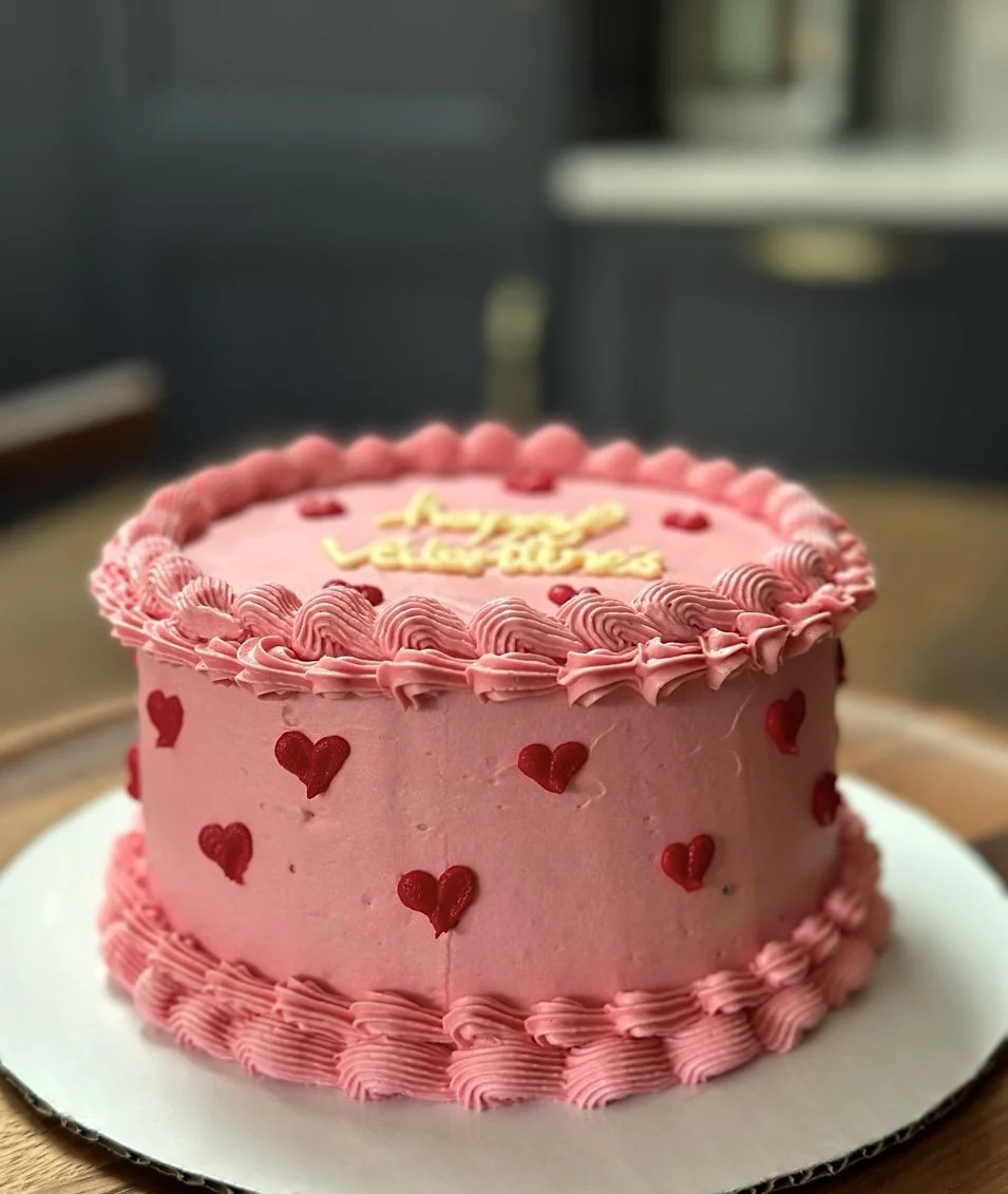 Piped pink hearts vintage Valentine's Day cake Cambridge