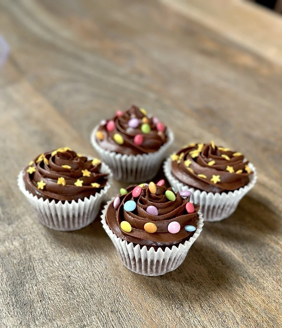 Chocolate party cupcakes with colourful sprinkles Cambridge UK