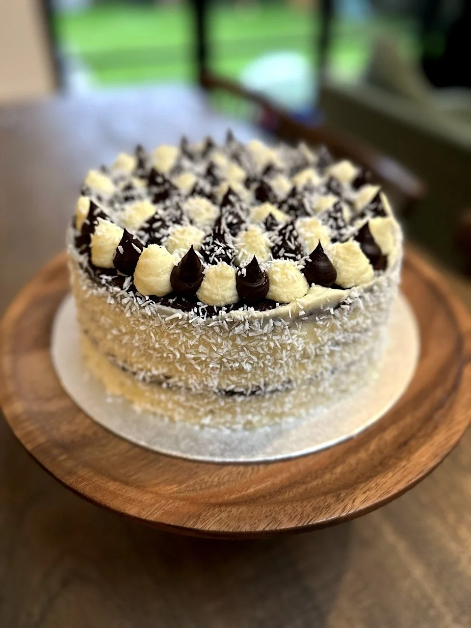 Custom chocolate coconut celebration cake baked fresh to order in Girton, Cambridge